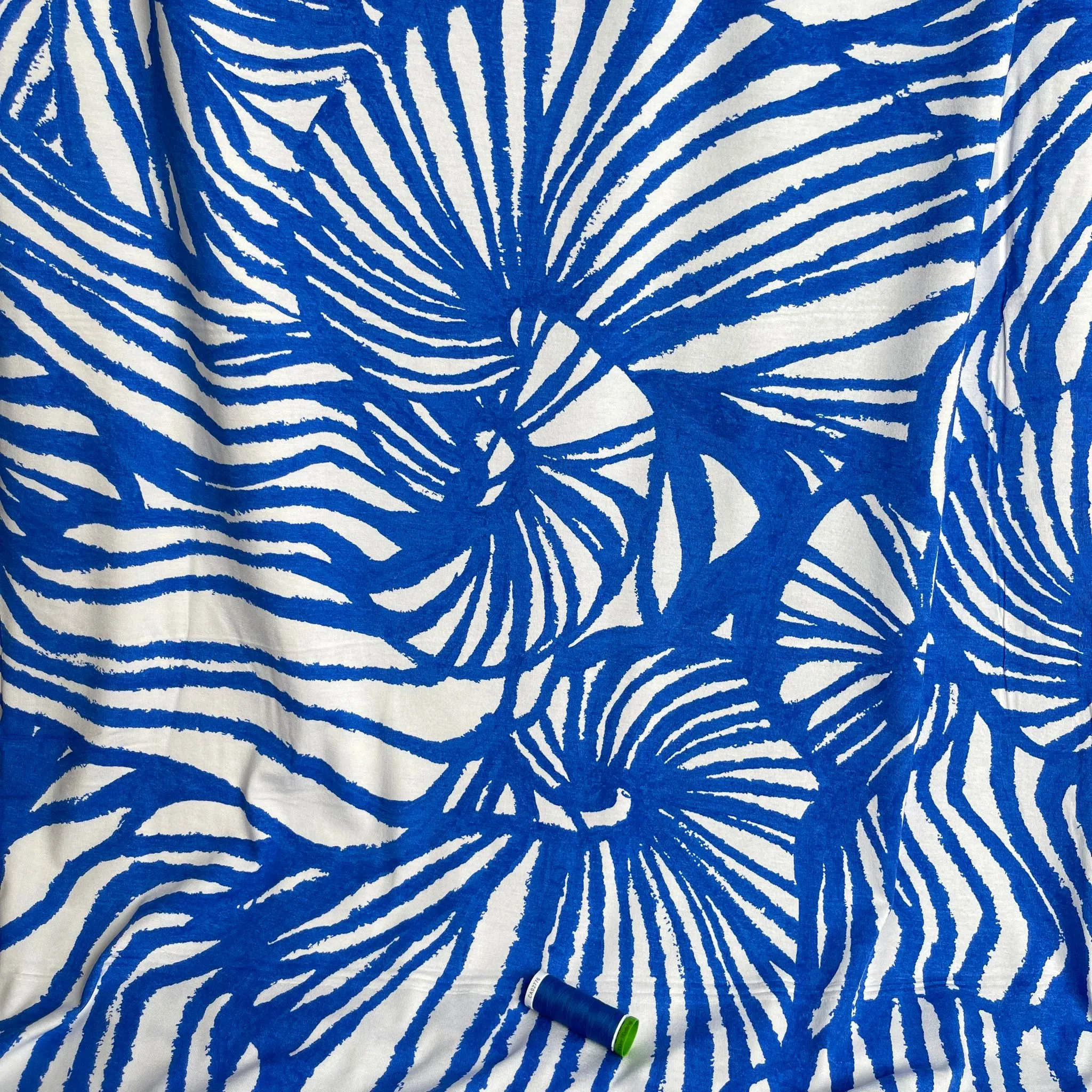 REMNANT 1.65 Metres - Ex-Designer Deadstock Ammonite Fossils on Blue Viscose Jersey Fabric