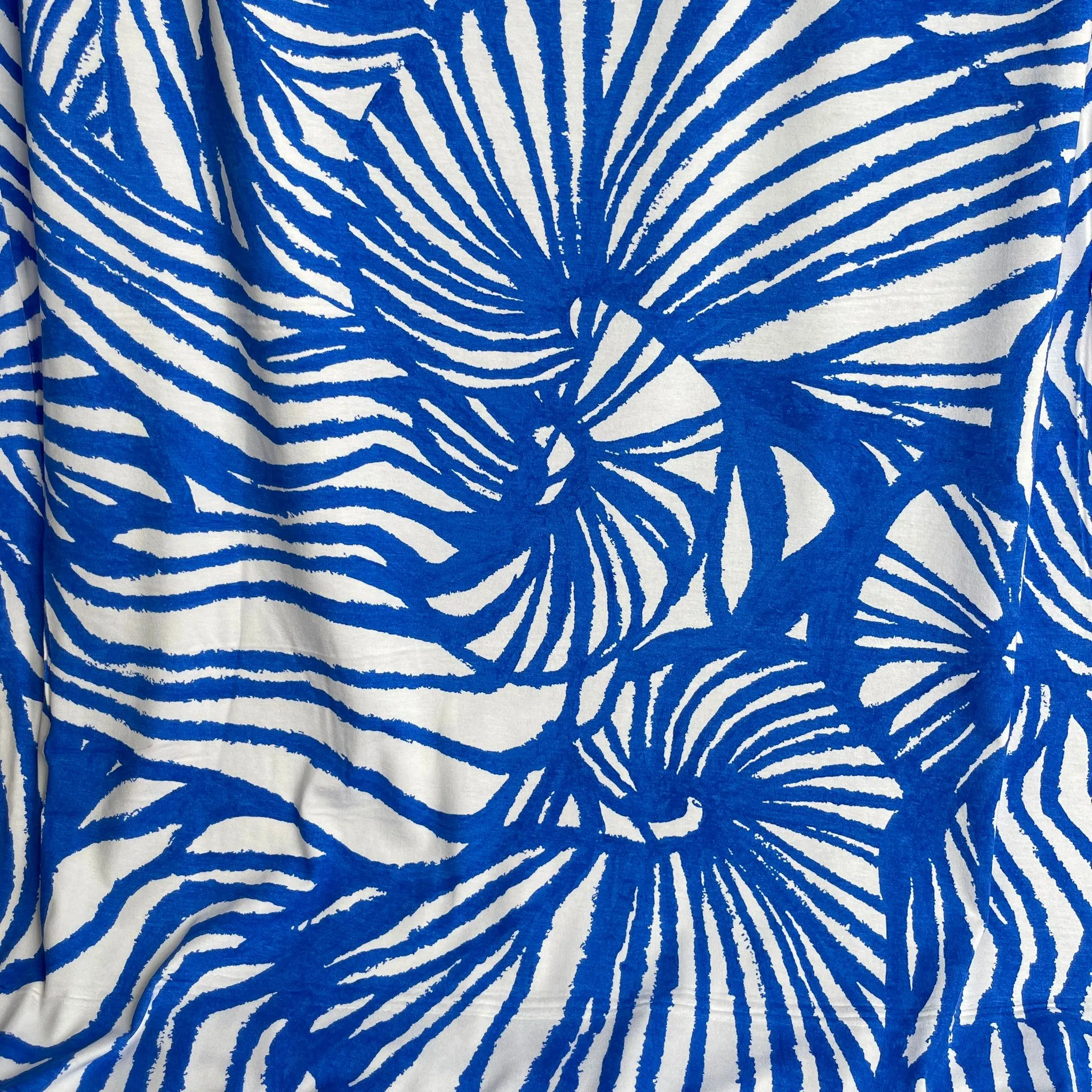REMNANT 1.65 Metres - Ex-Designer Deadstock Ammonite Fossils on Blue Viscose Jersey Fabric