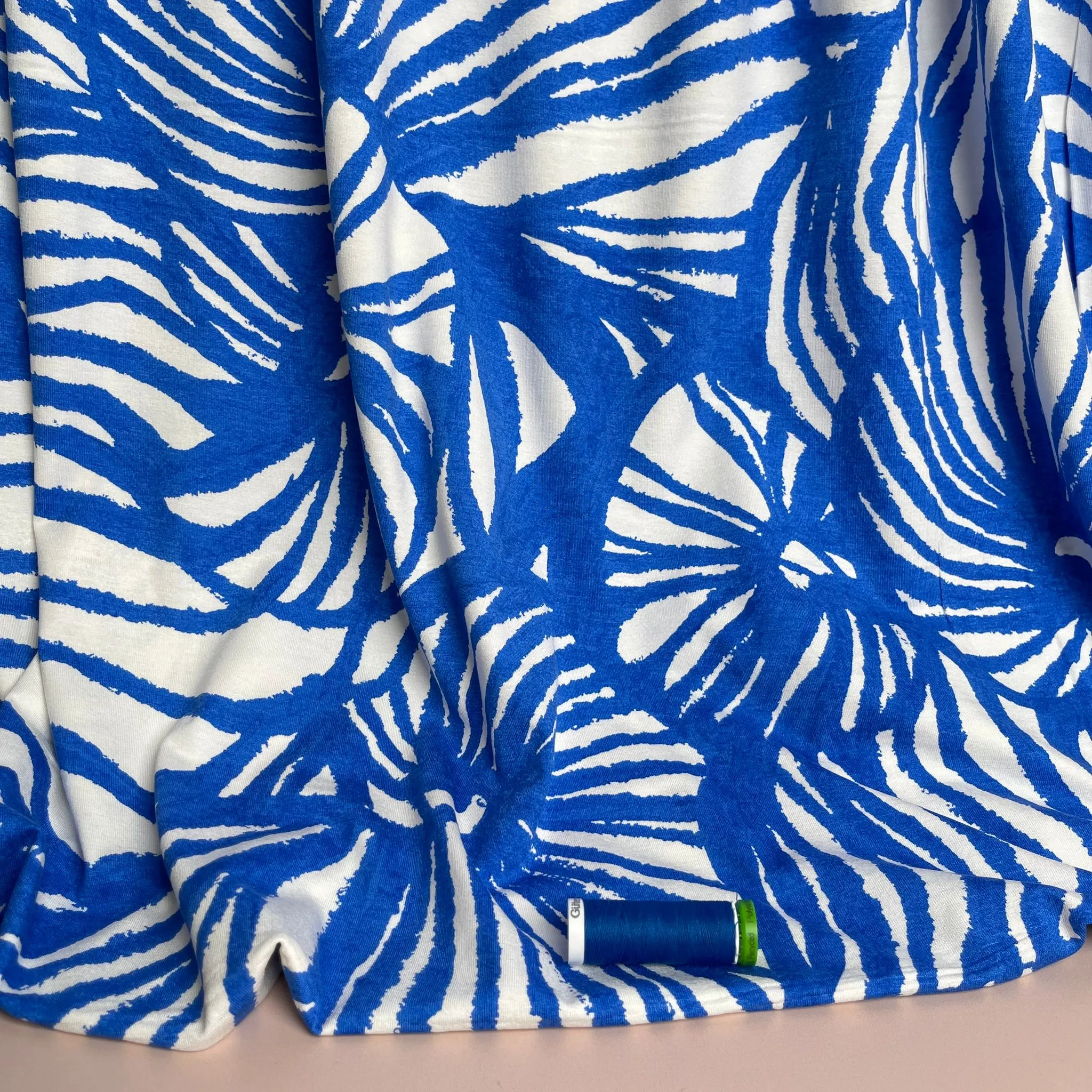 REMNANT 1.65 Metres - Ex-Designer Deadstock Ammonite Fossils on Blue Viscose Jersey Fabric