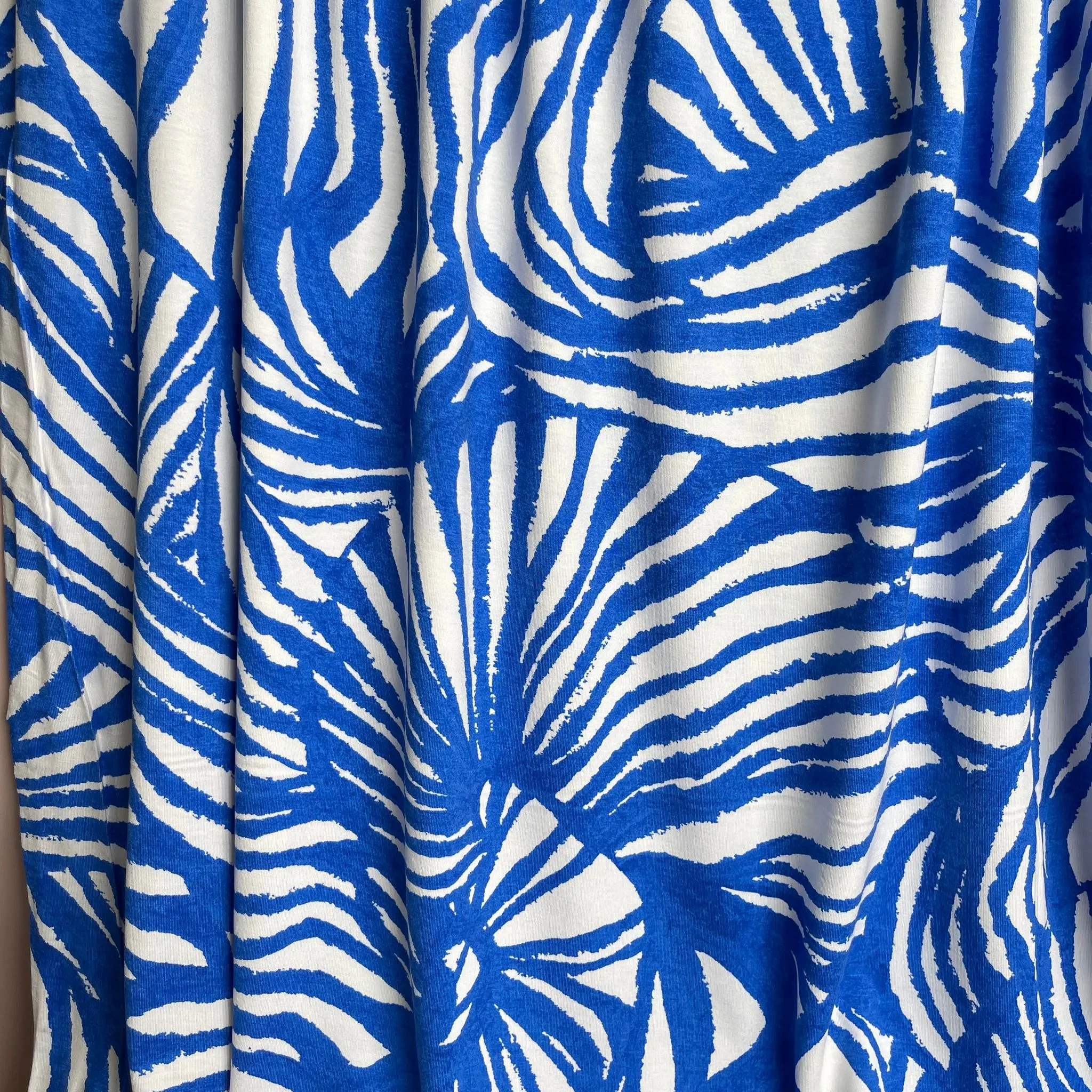REMNANT 1.65 Metres - Ex-Designer Deadstock Ammonite Fossils on Blue Viscose Jersey Fabric