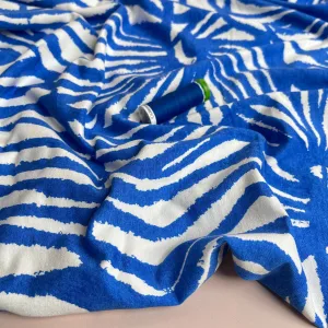 REMNANT 1.65 Metres - Ex-Designer Deadstock Ammonite Fossils on Blue Viscose Jersey Fabric