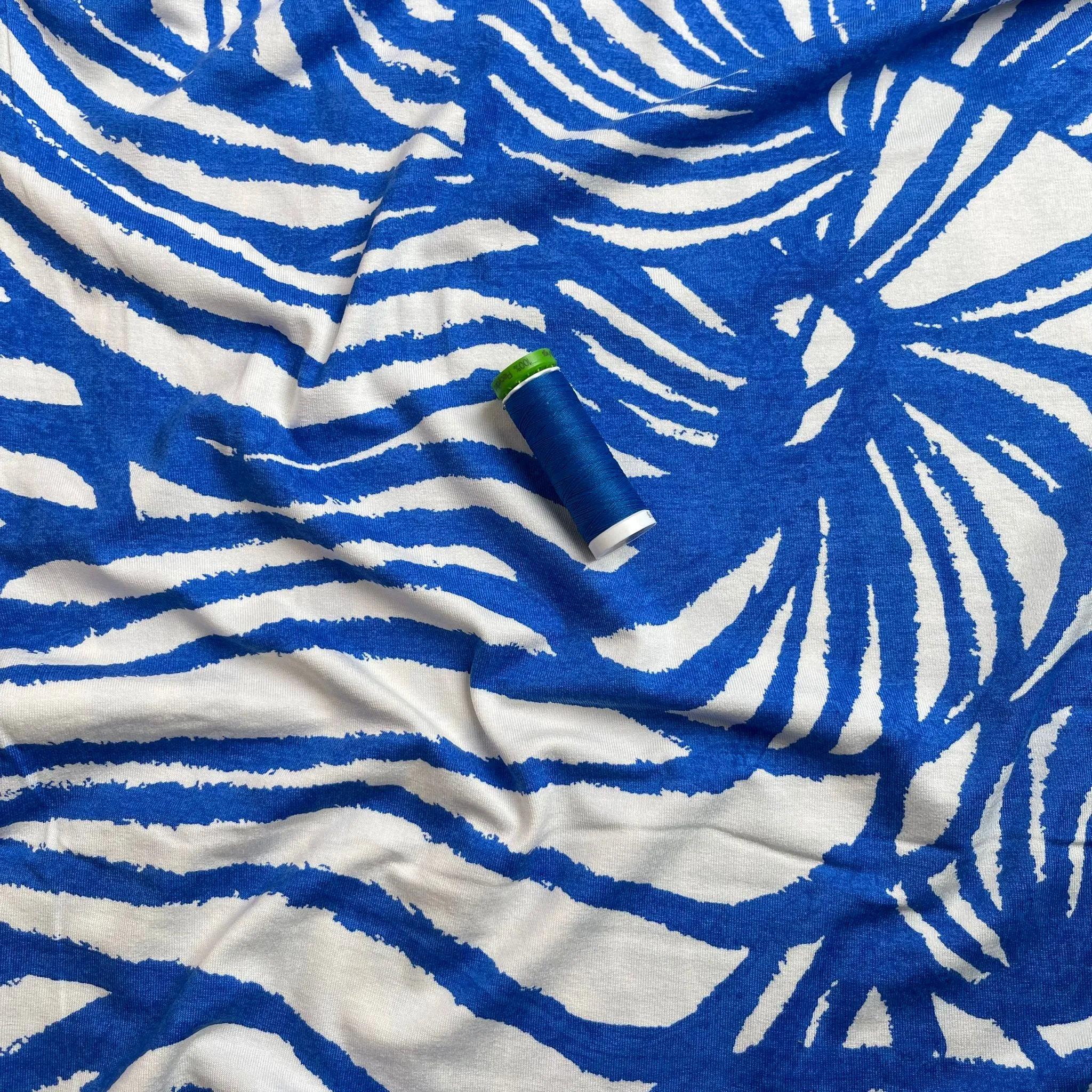 REMNANT 1.65 Metres - Ex-Designer Deadstock Ammonite Fossils on Blue Viscose Jersey Fabric