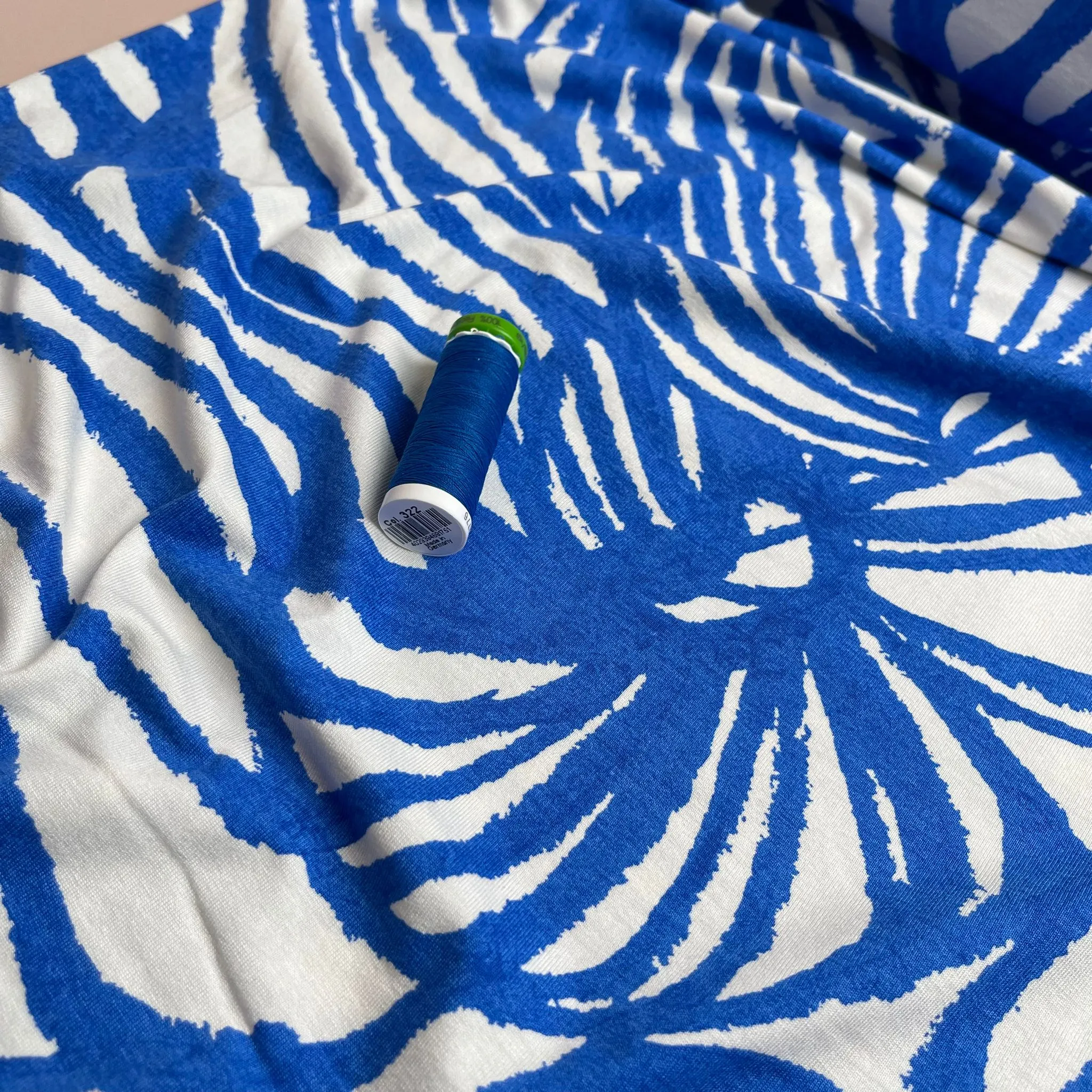 REMNANT 1.65 Metres - Ex-Designer Deadstock Ammonite Fossils on Blue Viscose Jersey Fabric