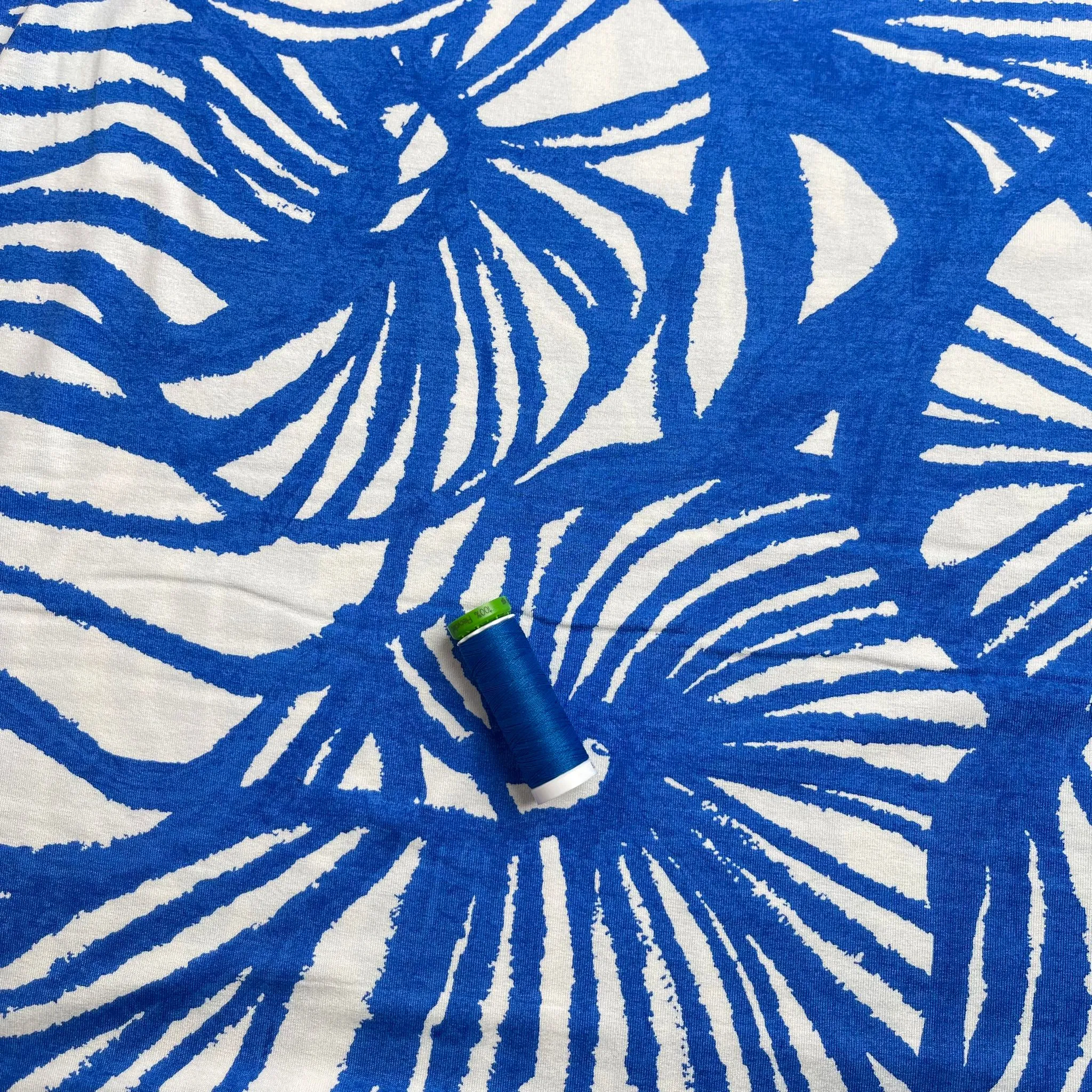 REMNANT 1.65 Metres - Ex-Designer Deadstock Ammonite Fossils on Blue Viscose Jersey Fabric