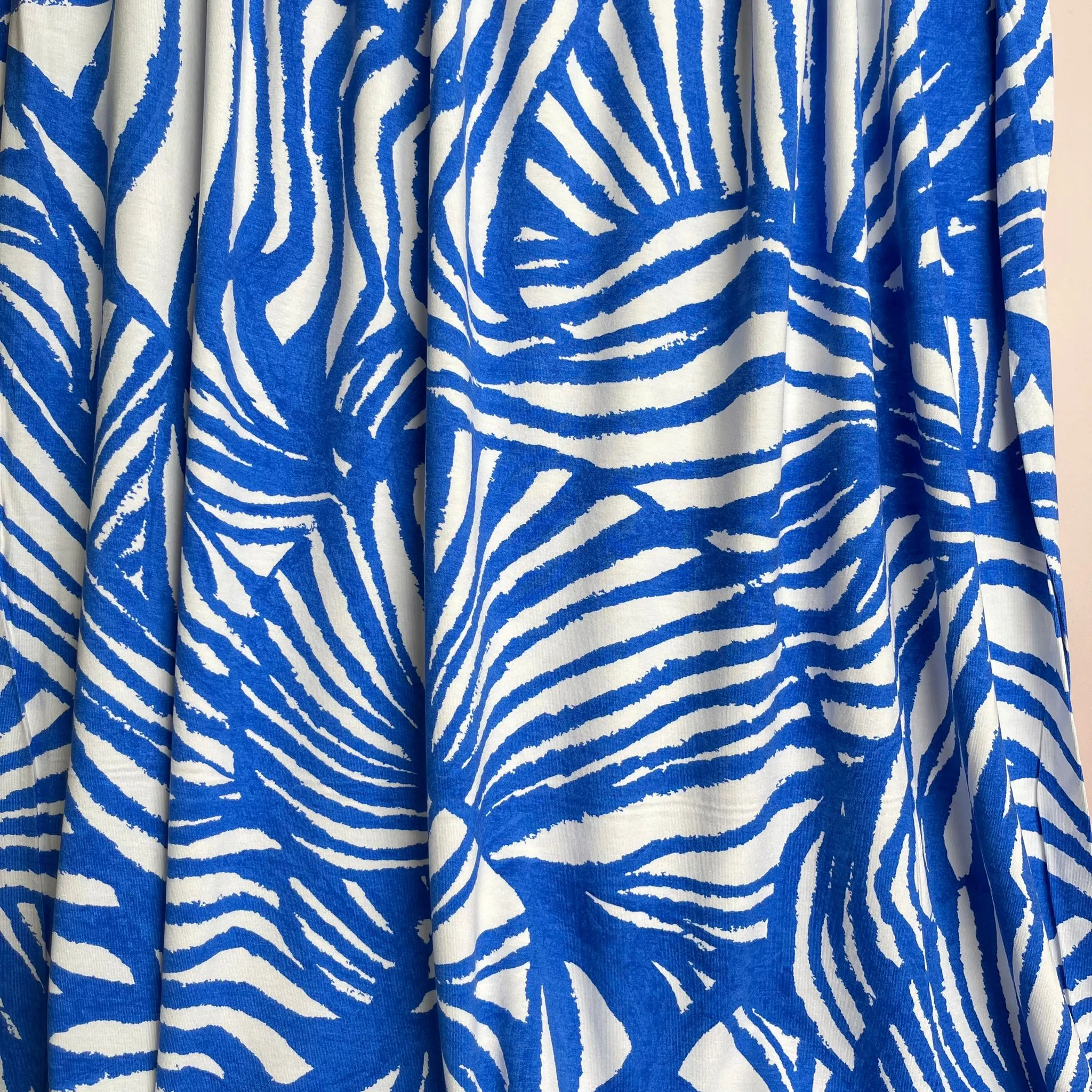 REMNANT 1.65 Metres - Ex-Designer Deadstock Ammonite Fossils on Blue Viscose Jersey Fabric