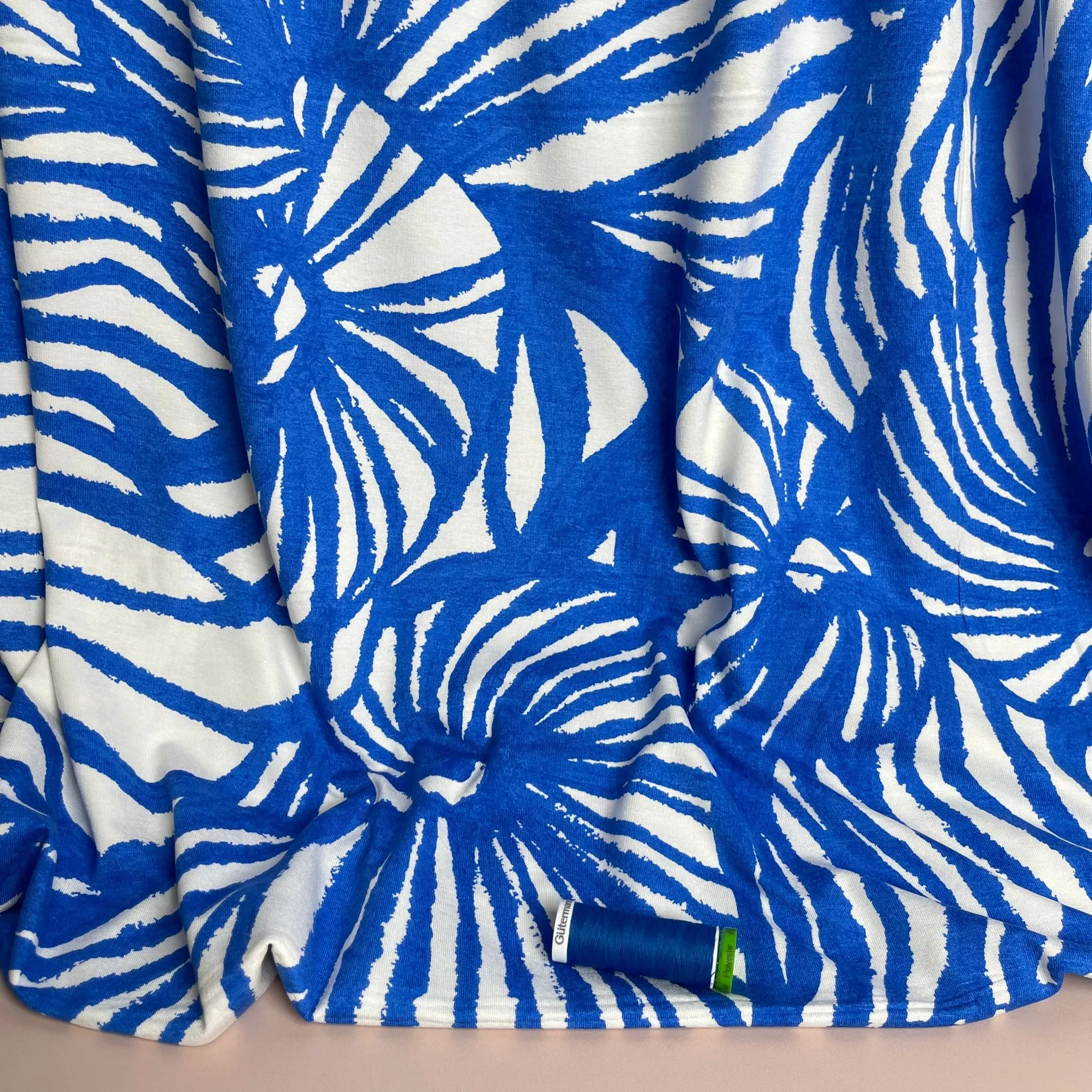 REMNANT 1.65 Metres - Ex-Designer Deadstock Ammonite Fossils on Blue Viscose Jersey Fabric
